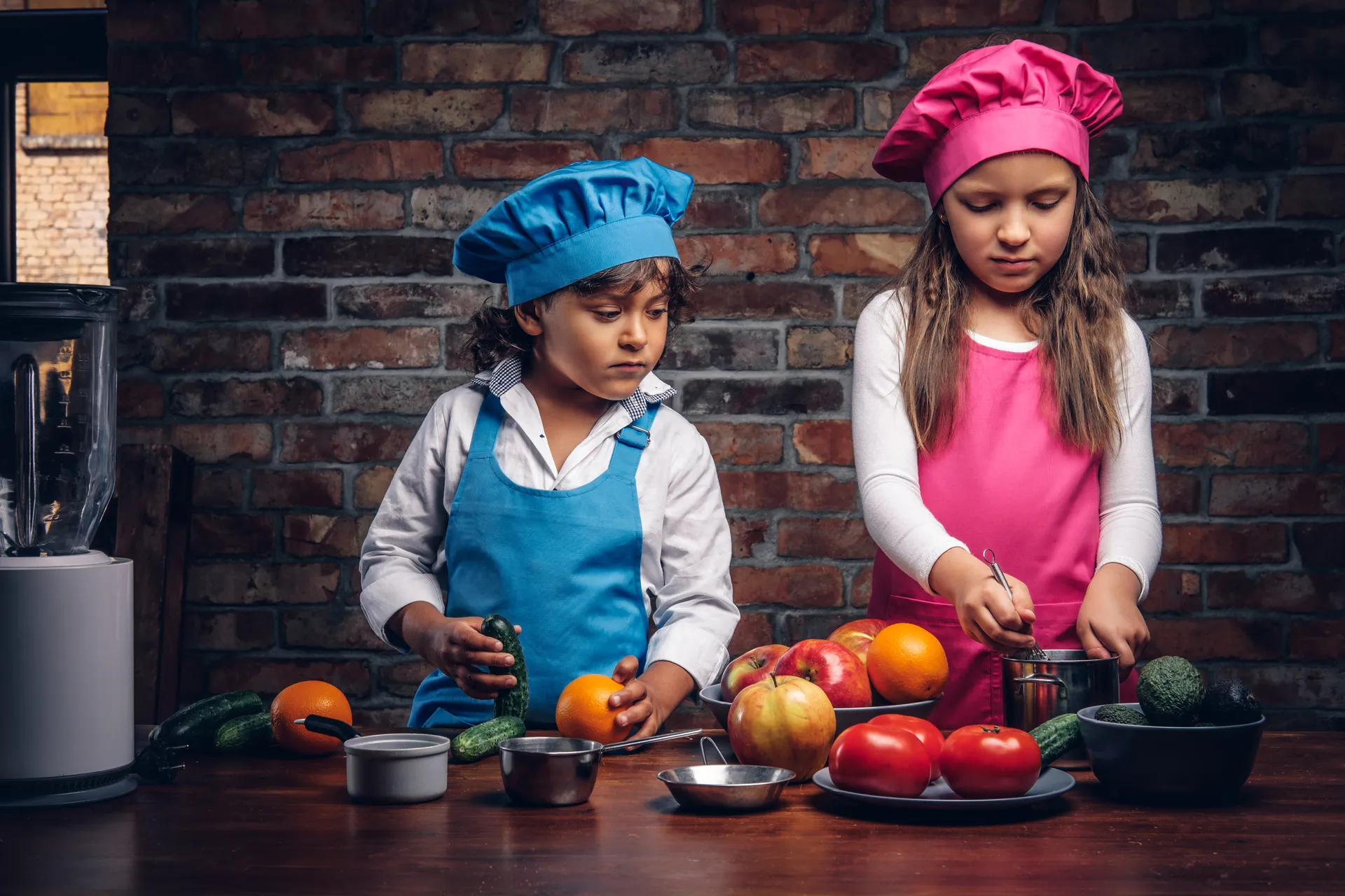 cute-little-cook-couple-little-boy-with-brown-curly-hair-dressed-blue-cook-uniform